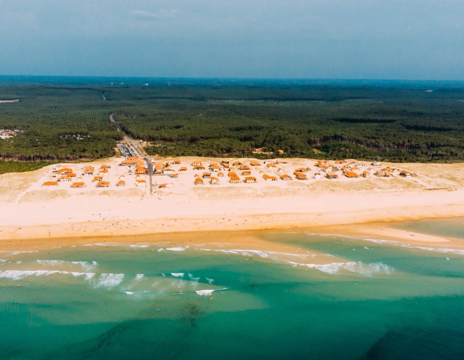 Plage Saint Girons and the neighboring village in full summer view. Photo provided by Saint Girons Surf House.