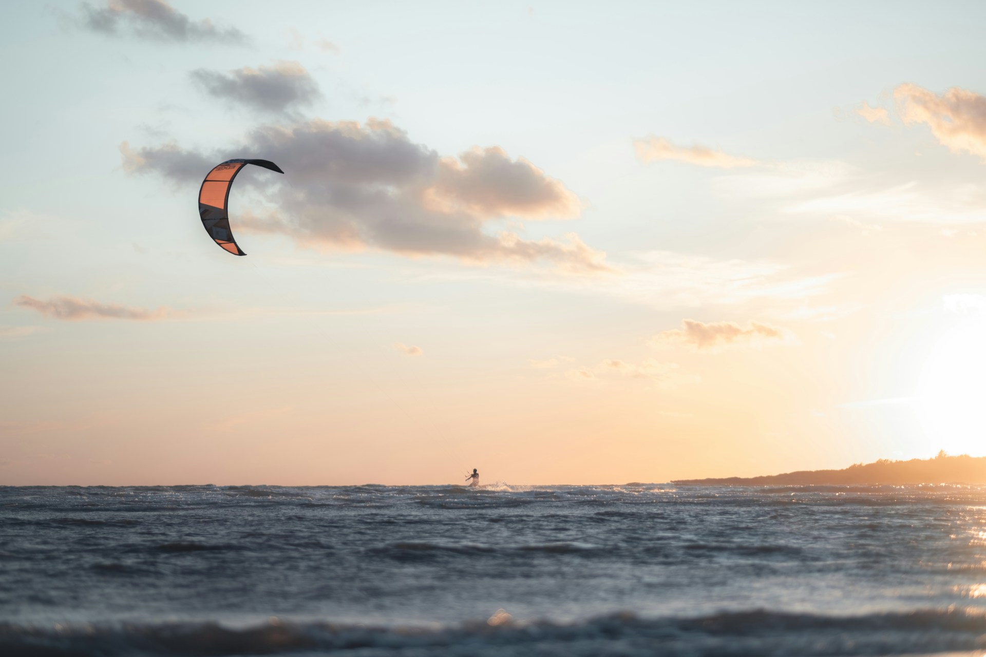 Not exactly surfing surfing, but a wind surfer enjoying the evening breezes in Varberg.