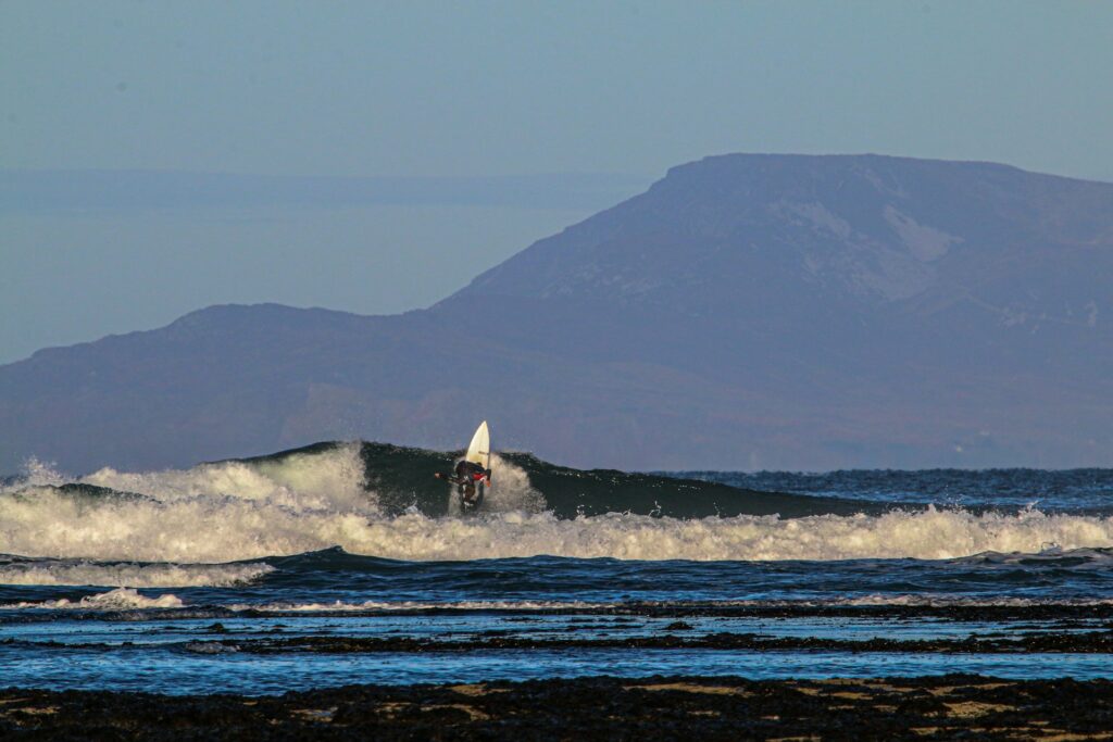 Surfer ripping on a prime wave around Bundoran.