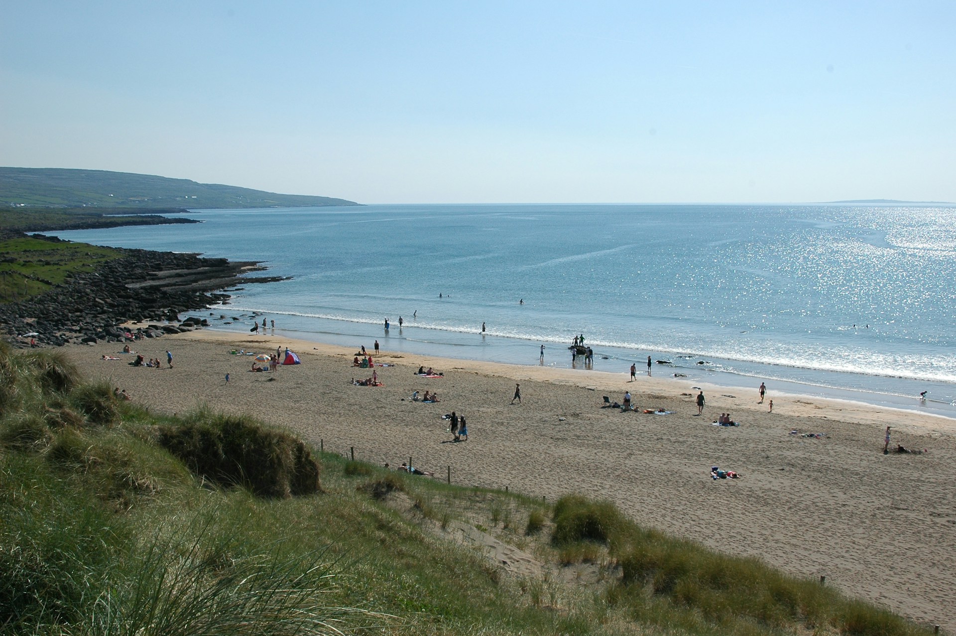 Fanore Beach on a sunny day with blue waters.