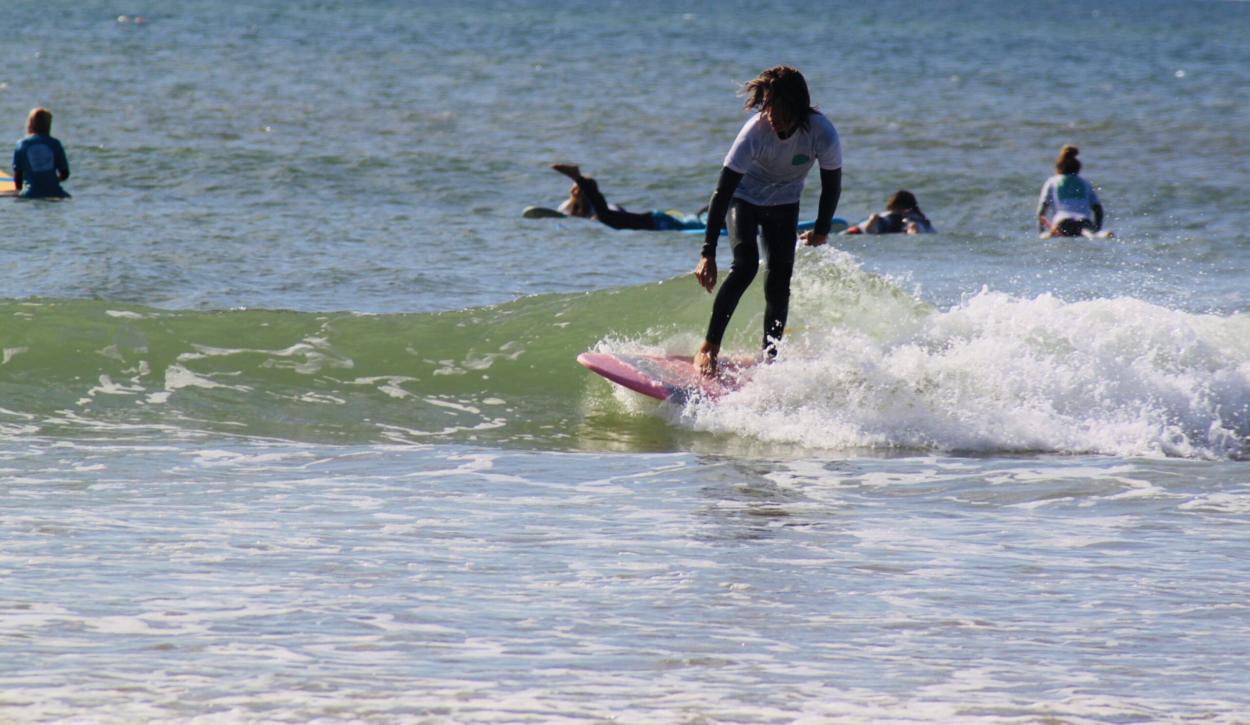 A legend of a beginner enjoying a fun surf lesson with It's On La Salie.