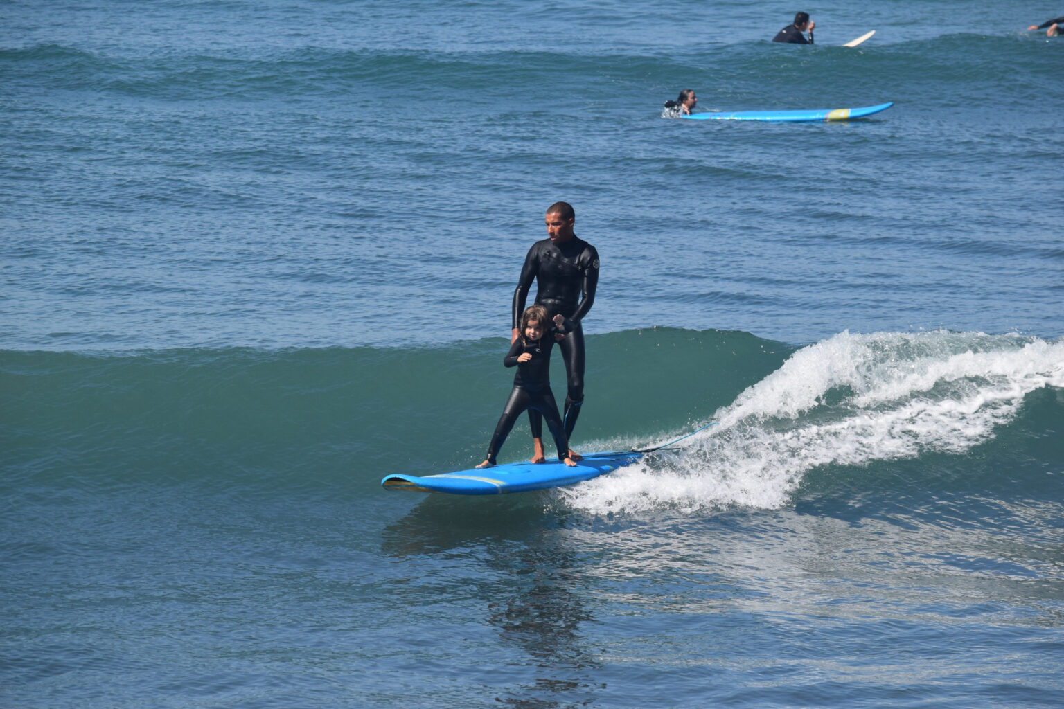 Just two peas in a pod enjoying a wave together.