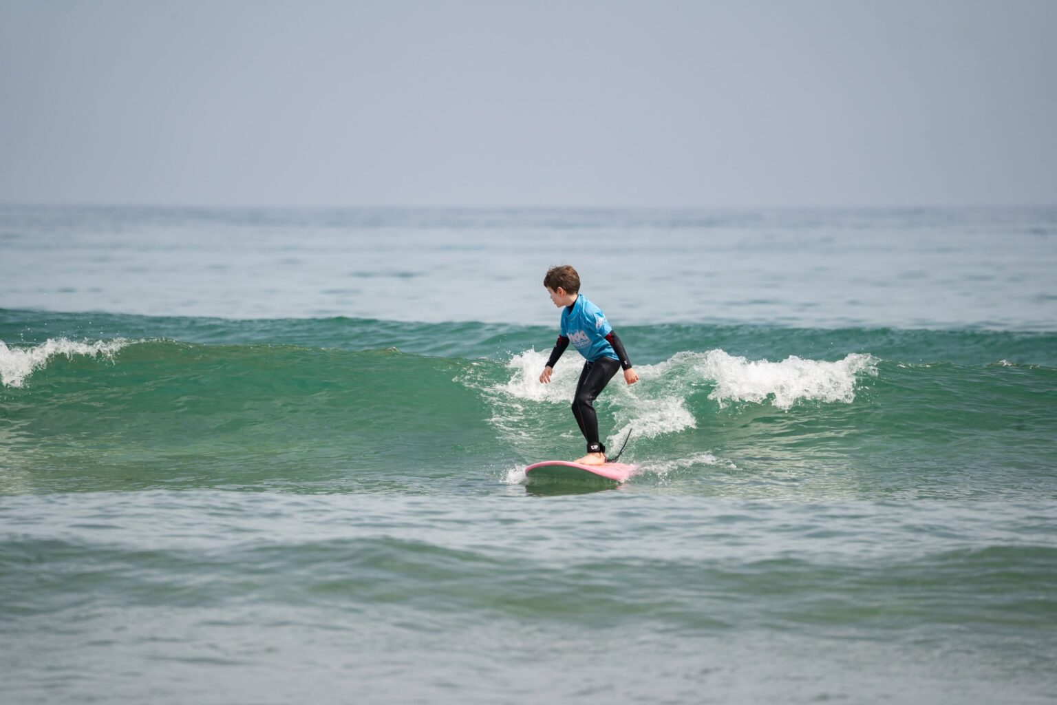 A grom ripping and shredding with the guidance of Buena Onda Surf School.