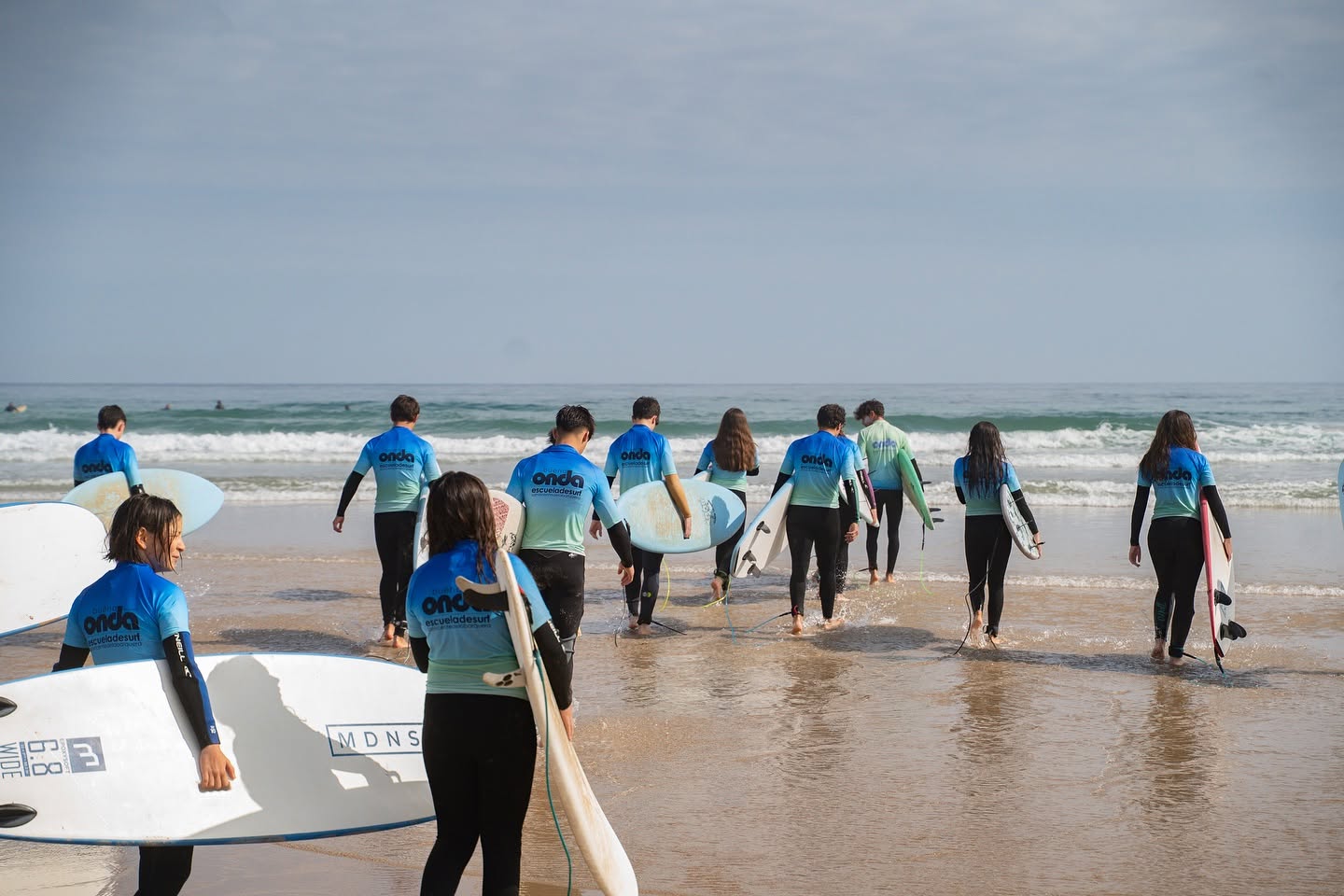 A group of students heading out for a lesson with Buena Onda Surf School.
