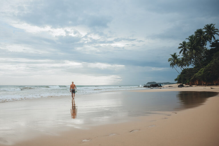 One of the campers at Gaia Soul wandering Maaliyadda Beach in search of waves.
